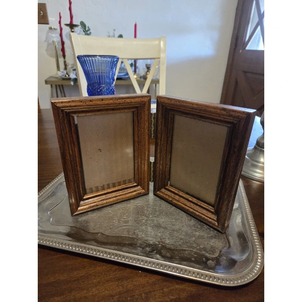 vintage bifold photo frame features a dark brown wood-grain finish and brass...